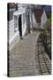 Steep Cobbled Street and White Wooden Houses-Eleanor Scriven-Stretched Canvas