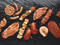 Assorted Meats and Sausages on Hot Stone Grill-Stefan Oberschelp-Laminated Photographic Print
