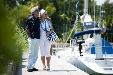 Happy Senior Couple Walking on a Dock in Summer-stefanolunardi-Framed Stretched Canvas