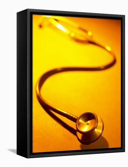 Stethoscope on Yellow Surface-null-Framed Stretched Canvas