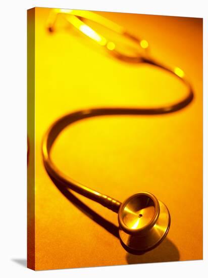 Stethoscope on Yellow Surface-null-Stretched Canvas