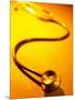 Stethoscope on Yellow Surface-null-Mounted Photographic Print