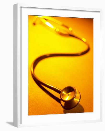 Stethoscope on Yellow Surface-null-Framed Photographic Print