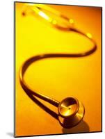 Stethoscope on Yellow Surface-null-Mounted Photographic Print