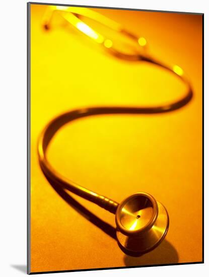 Stethoscope on Yellow Surface-null-Mounted Photographic Print