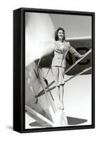 Stewardess Balancing on Plane Wheel-null-Framed Stretched Canvas