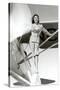 Stewardess Balancing on Plane Wheel-null-Stretched Canvas