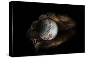 Still-Life Image of Baseball Nestled in a Mitt or Glove-Sheila Haddad-Stretched Canvas