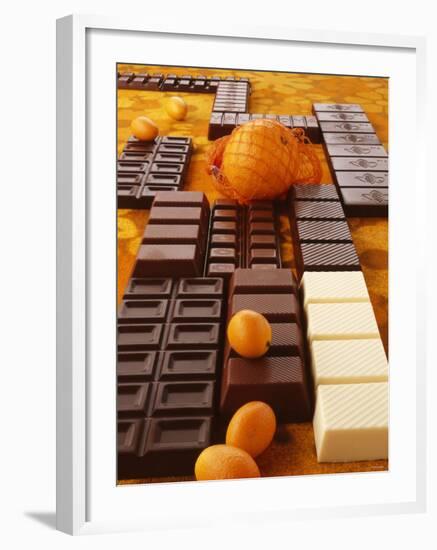 Still Life of Chocolate Bars and Citrus Fruit-Luzia Ellert-Framed Photographic Print