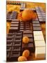 Still Life of Chocolate Bars and Citrus Fruit-Luzia Ellert-Mounted Photographic Print