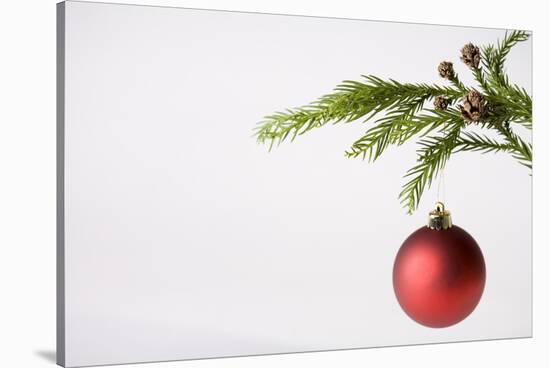 Still Life of Red Bauble Hanging on Christmas Tree-null-Stretched Canvas