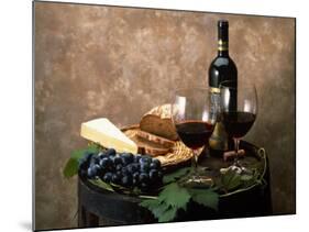 Still Life of Wine Bottle, Wine Glasses, Cheese and Purple Grapes on Top of Barrel-null-Mounted Photographic Print