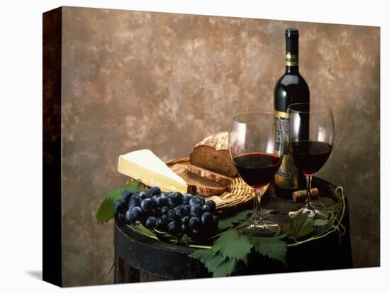 Still Life of Wine Bottle, Wine Glasses, Cheese and Purple Grapes on Top of Barrel-null-Stretched Canvas