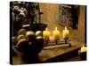 Still Life with Lighted Candles and Bowl of Lemons in Coffee Shop, Tallinn, Estonia-Nancy & Steve Ross-Stretched Canvas