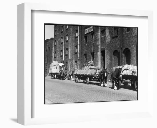 Stock Is Unloaded from Horse- Pulled Wagons and Drawn Up into the Warehouse by Rope-null-Framed Photographic Print