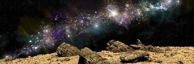 A Colorful Nebula Above a Rocky and Barren Alien World