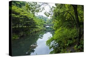 Stone Bridge with Flowers in Seogwipo, Jejudo Island, South Korea-Michael Runkel-Stretched Canvas