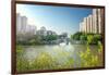 Stone bridge with pagoda style roofing, flanked by old style apartment buildings on the left and ne-Andreas Brandl-Framed Photographic Print