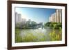 Stone bridge with pagoda style roofing, flanked by old style apartment buildings on the left and ne-Andreas Brandl-Framed Photographic Print