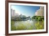 Stone bridge with pagoda style roofing, flanked by old style apartment buildings on the left and ne-Andreas Brandl-Framed Photographic Print