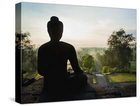 Stone Buddha Silhouetted at Sunrise, Borobudur Temple, UNESCO World Heritage Site, Java, Indonesia-Matthew Williams-Ellis-Stretched Canvas