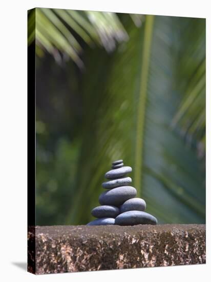 Stones Balanced on Rock, Palm Trees in Background, Maldives, Indian Ocean-Papadopoulos Sakis-Stretched Canvas