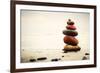 Stones Pyramid on Sand Symbolizing Zen, Harmony, Balance. Ocean in the Background-Michal Bednarek-Framed Photographic Print