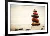 Stones Pyramid on Sand Symbolizing Zen, Harmony, Balance. Ocean in the Background-Michal Bednarek-Framed Photographic Print