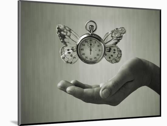 Stopwatch With Butterfly Wings Levitating Above Hand, Black And White, Slight Green Toning-foodbytes-Mounted Art Print