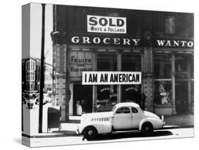 Store Sign Reads, "I am an American," After Pearl Harbor Attack, and "Sold", Following Evacuation-Dorothea Lange-Stretched Canvas