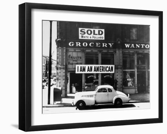 Store Sign Reads, "I am an American," After Pearl Harbor Attack, and "Sold", Following Evacuation-Dorothea Lange-Framed Photographic Print