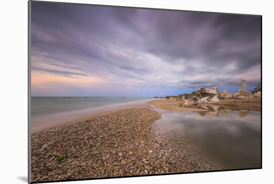 Storm clouds are reflected in the clear water at sunset, Porto Recanati, Conero Riviera, Italy-Roberto Moiola-Mounted Photographic Print