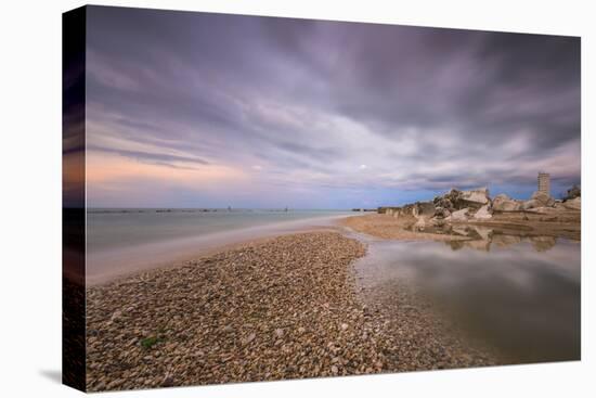 Storm clouds are reflected in the clear water at sunset, Porto Recanati, Conero Riviera, Italy-Roberto Moiola-Stretched Canvas