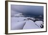 Storm clouds on the snowy peaks reflected in the cold sea at night, Haukland, Northern Norway-Roberto Moiola-Framed Photographic Print