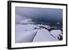 Storm clouds on the snowy peaks reflected in the cold sea at night, Haukland, Northern Norway-Roberto Moiola-Framed Photographic Print