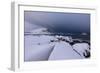 Storm clouds on the snowy peaks reflected in the cold sea at night, Haukland, Northern Norway-Roberto Moiola-Framed Photographic Print