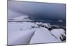 Storm clouds on the snowy peaks reflected in the cold sea at night, Haukland, Northern Norway-Roberto Moiola-Mounted Photographic Print