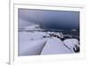 Storm clouds on the snowy peaks reflected in the cold sea at night, Haukland, Northern Norway-Roberto Moiola-Framed Photographic Print