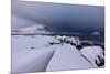 Storm clouds on the snowy peaks reflected in the cold sea at night, Haukland, Northern Norway-Roberto Moiola-Mounted Photographic Print