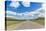 Straight road in the Mongolian steppe and clouds in the sky, North Hangay province, Mongolia, Centr-Francesco Vaninetti-Stretched Canvas