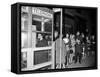 Stranded New York Workers Wait Patiently in a Long Line to Use a Phone Booth to Call Home-null-Framed Stretched Canvas