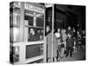 Stranded New York Workers Wait Patiently in a Long Line to Use a Phone Booth to Call Home-null-Stretched Canvas