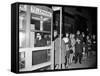 Stranded New York Workers Wait Patiently in a Long Line to Use a Phone Booth to Call Home-null-Framed Stretched Canvas