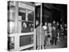 Stranded New York Workers Wait Patiently in a Long Line to Use a Phone Booth to Call Home-null-Stretched Canvas