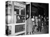 Stranded New York Workers Wait Patiently in a Long Line to Use a Phone Booth to Call Home-null-Stretched Canvas