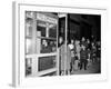 Stranded New York Workers Wait Patiently in a Long Line to Use a Phone Booth to Call Home-null-Framed Photographic Print