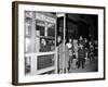 Stranded New York Workers Wait Patiently in a Long Line to Use a Phone Booth to Call Home-null-Framed Photographic Print