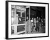 Stranded New York Workers Wait Patiently in a Long Line to Use a Phone Booth to Call Home-null-Framed Photographic Print