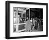 Stranded New York Workers Wait Patiently in a Long Line to Use a Phone Booth to Call Home-null-Framed Photographic Print