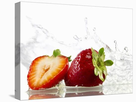 Strawberries with Splashing Water-Michael L?ffler-Stretched Canvas